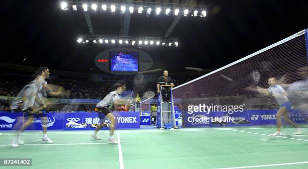 The multiple exposure photo shows Thailand's Sudket Prapakamol and his teammate Saralee Thoungthongkam competing against Alexander Nikolaenko and...