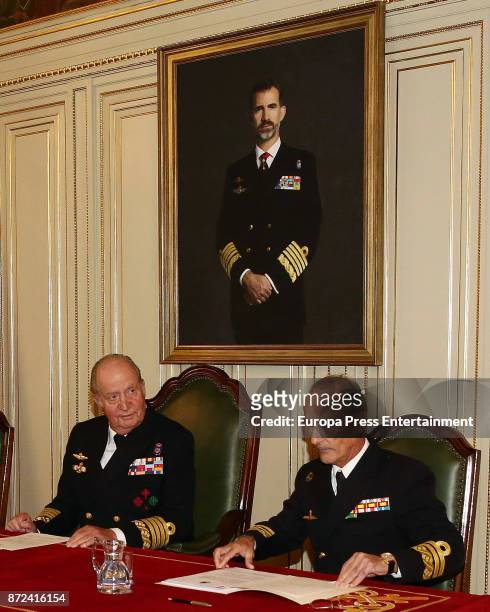 King Juan Carlos , close to a painting of his son King Felipe VI, attends Naval Museum board meeting on November 8, 2017 in Madrid, Spain.