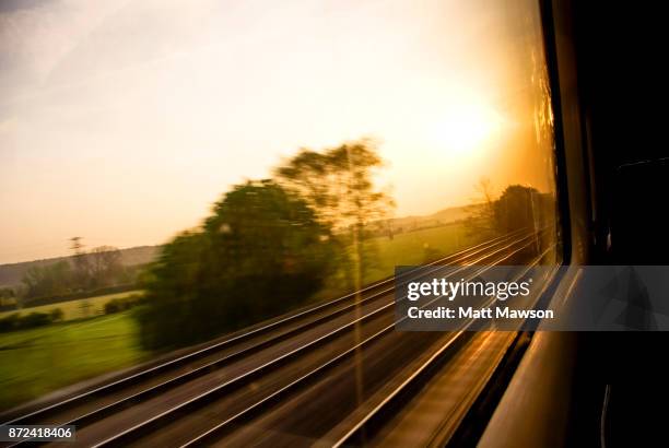 views of the english countryside at dawn through a train window. uk - dawn window stock pictures, royalty-free photos & images