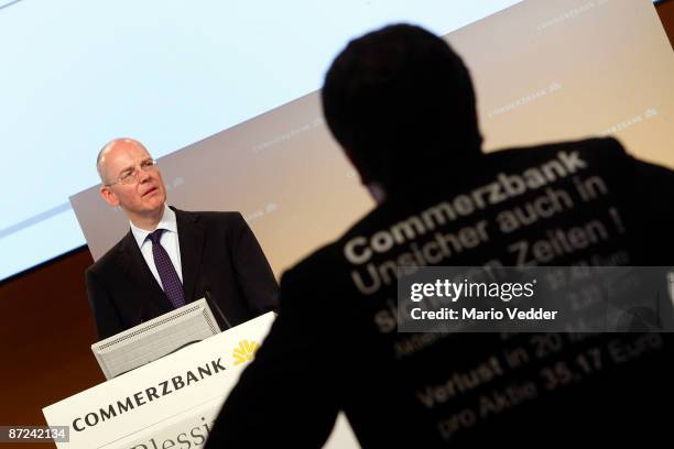 Martin Blessing, CEO of the Commerzbank AG, looks on during the annual shareholders meeting on May 15, 2009 in Frankfurt am Main, Germany, while a...