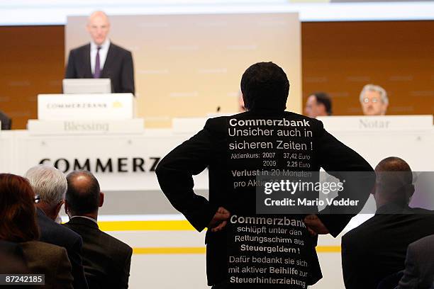 Martin Blessing, CEO of the Commerzbank AG, looks on during the annual shareholders meeting on May 15, 2009 in Frankfurt am Main, Germany, while a...