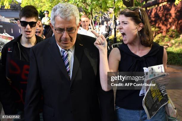 Protesters heckle people attending a Liberal Party fundraiser in Sydney on November 10 as the protesters call on the ruling Liberal coalition...