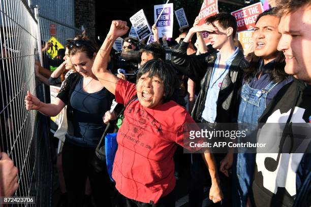 Protesters chant at a Liberal Party fundraiser in Sydney on November 10 as they call on the ruling Liberal coalition government to bring back 600...