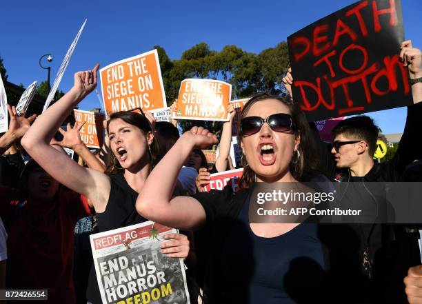 Protesters chant at a Liberal Party fundraiser in Sydney on November 10 as they call on the ruling Liberal coalition government to bring back 600...