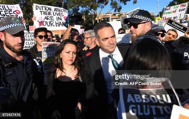 Protesters heckle people attending a Liberal Party fundraiser in Sydney on November 10 as the protesters call on the ruling Liberal coalition...