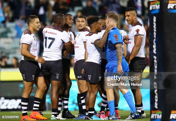 Suliasi Vunivalu of Fiji has words with Nathan Brown of Italy after he scored during the 2017 Rugby League World Cup match between Fiji and Italy at...