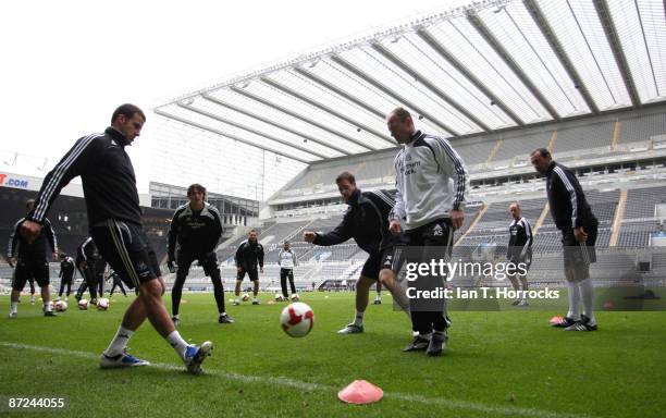Steven Taylor passes to manager Alan Shearer during a Newcastle United training session at St James' Park, on May 15 in Newcastle upon Tyne, England....