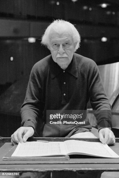 Portrait of American conductor Arthur Fiedler as he poses with an open book of sheet music at the Kennedy Center, Washington DC, January 21, 1977.