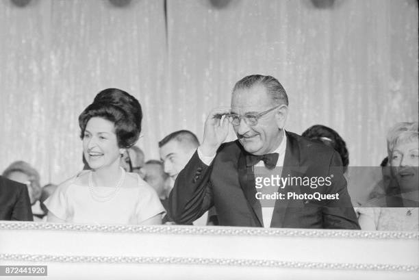 View of First Lady Lady Bird Johnson and US President Lyndon B Johnson laugh during an Inaugural Ball at the Sheraton Park Hotel, Washington DC,...