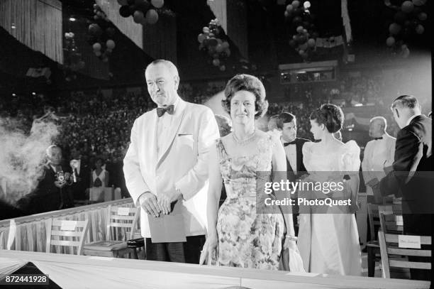 View of American politician US President Lyndon B Johnson and his wife, First Lady Lady Bird Johnson as they attend a Democratic fund-raiser,...