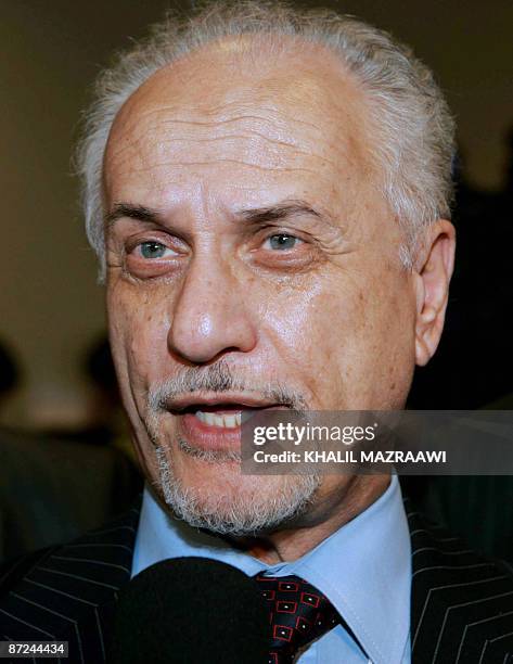 Iraqi Oil Minister Hussein al-Shahristani talks to a reporter on the sidelines of the opening day of the World Economic Forum in Shuneh, on the...