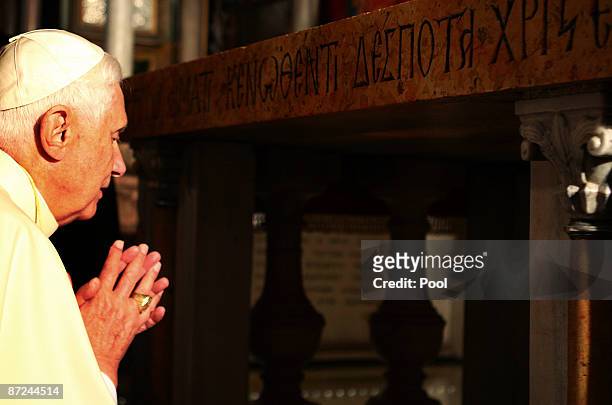 Pope Benedict XVI prays at the traditional site where Jesus was crucified in the Golgotha, or Calvary, in the Church of the Holy Sepulchre on May 15,...