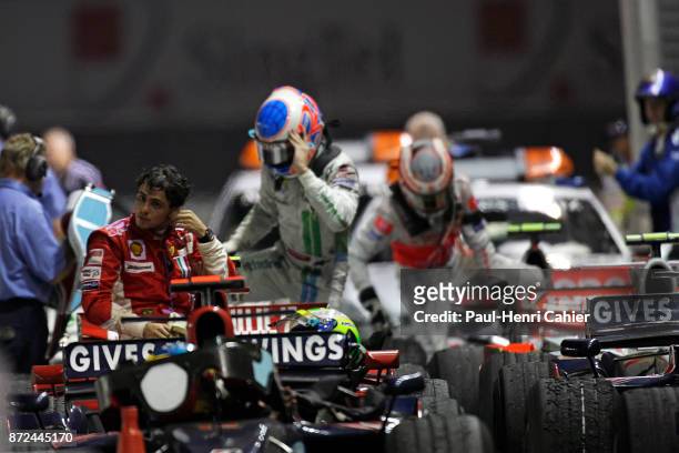 Felipe Massa, Jenson Button, Heikki Kovalainen, Ferrari F2008, Grand Prix of Singapore, Marina Bay Street Circuit, 28 September 2008. An exhausted...