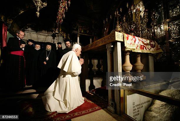 Pope Benedict XVI prays at the Golgotha, or Calvary, the traditional site where Jesus was crucified, in the Church of the Holy Sepulchre on May 15,...