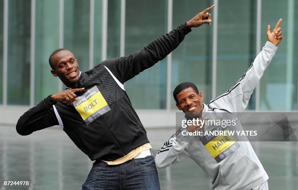 Jamaican sprinter Usain Bolt and Ethiopian distance runner Haile Gebrselassie pose togeather for photographers in Manchester City Centre in...