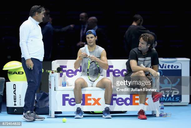 Coach Toni Nadal , Rafael Nadal of Spain and coach Carlos Moyá during a training session prior to the Nitto ATP World Tour Finals at O2 Arena on...