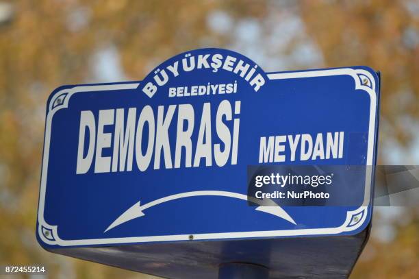 Street sign bears the 'Democracy Square' as families and their supporters gathered to commemorate the victims of Turkey's deadliest terror attack in...