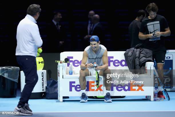 Coach Toni Nadal , Rafael Nadal of Spain and coach Carlos Moyá during a training session prior to the Nitto ATP World Tour Finals at O2 Arena on...