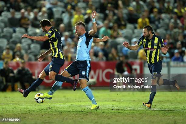 Jordy Buijs of Sydney FC is tackled by the Mariners defence during the round six A-League match between the Central Coast Mariners and Sydney FC at...