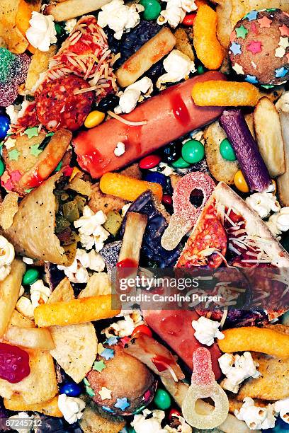 a messy pile of junk food - unhealthy eating stock pictures, royalty-free photos & images