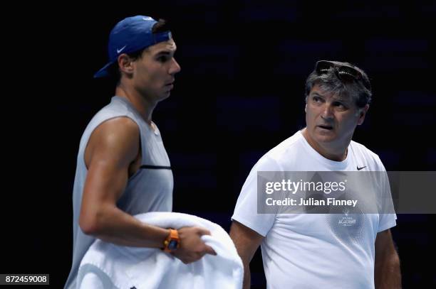 Rafael Nadal of Spain and Toni Nadal speak during a training session prior to the Nitto ATP World Tour Finals at O2 Arena on November 10, 2017 in...