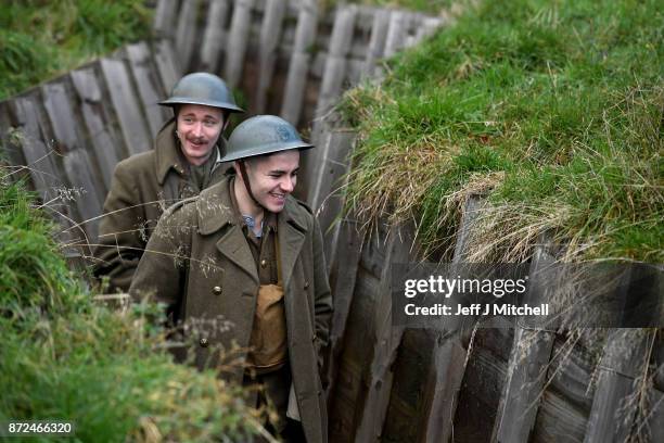 Actors Sam Duncane and Jake Morgan, from the Somme-inspired West End production The Wipers Times pose for photographs in a recreated First World War...