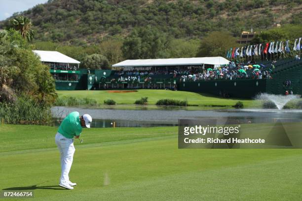 Lee Westwood of England hits an approach shot to the 18th green during the second round of the Nedbank Golf Challenge at Gary Player CC on November...
