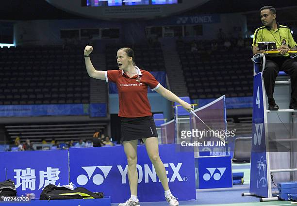 Denmark's Kamilla Rytter Juhl reacts to a winning point during the women's doubles play-off match against Britain's Jennifer Wallwork and Donna...
