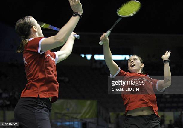 Denmark's Kamilla Rytter Juhl and Lena Frier Kristiansen compete during the women's doubles play-off match against Britain's Jennifer Wallwork and...