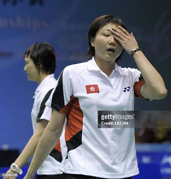 Hong Kong's Zhou Mi reacts to a losing point with her teammate Wang Chen against Japan's Miyuki Maeda and Satoko Suetsuna during the women's doubles...