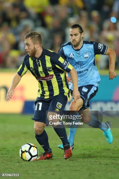 Connor Pain of the Mariners contests the ball with Joshua Brillante of Sydney FC during the round six A-League match between the Central Coast...