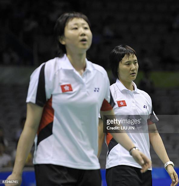 Hong Kong's Wang Chen and her teammate Zhou Mi compete against Japan's Miyuki Maeda and Satoko Suetsuna during the women's doubles play-off match at...