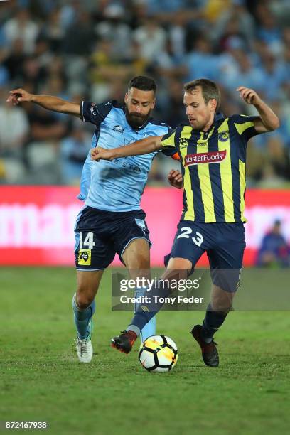 Wout Brama of the Mariners controls the ball from Alex Brosque of Sydney FC during the round six A-League match between the Central Coast Mariners...