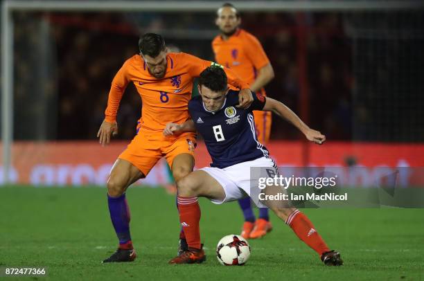 Kevin Strootman of Netherlands vies with John McGinn of Scotland during the International Friendly between Scotland and Netherlands at Pittodrie...