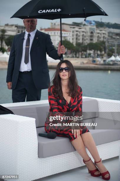 Italian actress Monica Bellucci poses during the record of Canal Plus program "l'Hebdo du Cinema" with French TV host Daphne Roulier on May 15, 2009...