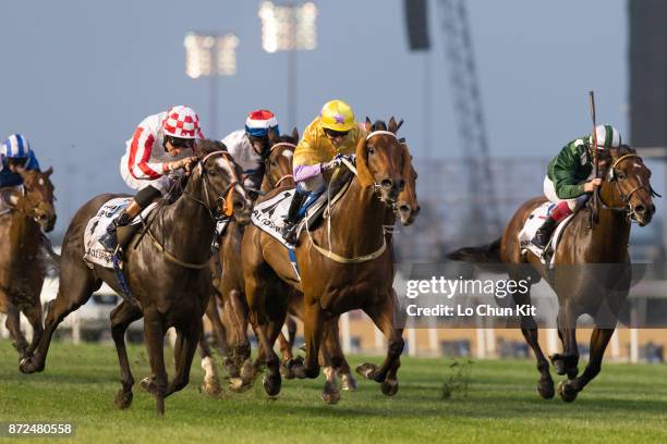 Jockey Richard Hughes riding Sole Power wins in the Al Quoz Sprint during the Dubai World Cup race day at the Meydan racecourse on March 28, 2015 in...