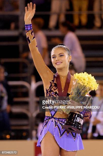 Russian gymnast Alina Kabaeva waves after receiving her gold medal during the XXIV World Championships of Rhythmic Gymnastics 20 October 2001 at...