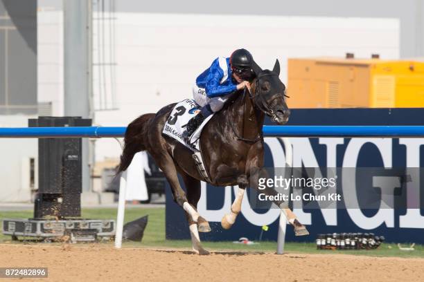 Jockey Dane O'Neill riding Manark wins the Dubai Kahayla Classic during the Dubai World Cup race day at the Meydan racecourse on March 28, 2015 in...