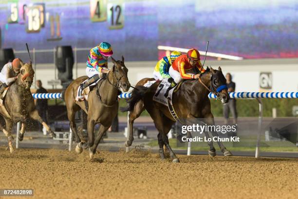 Jockey Victor Espinoza riding Secret Circle wins the Dubai Golden Shaheen during the Dubai World Cup race day at the Meydan racecourse on March 28,...