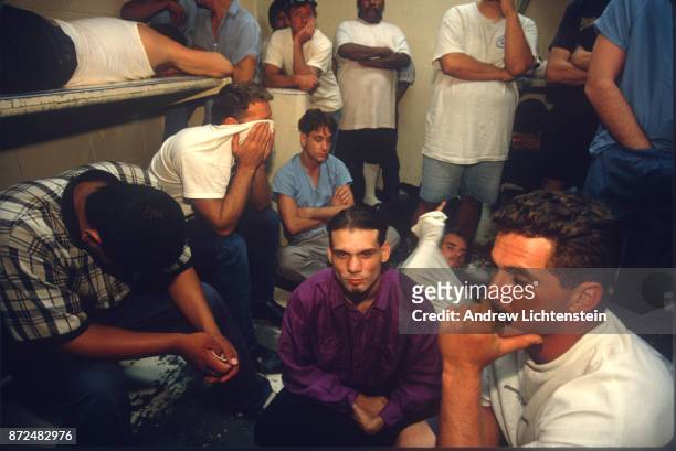 Arrested citizens wait out the night in the Maricopa County jail on April 12, 1995 in Phoenix, Arizona. Aggressive law enforcement by the county...
