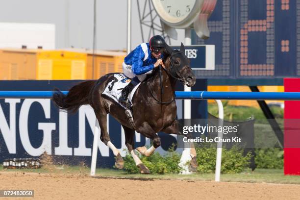 Jockey Dane O'Neill riding Manark wins the Dubai Kahayla Classic during the Dubai World Cup race day at the Meydan racecourse on March 28, 2015 in...