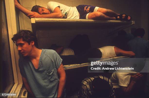 Arrested citizens wait out the night in the Maricopa County jail on April 12, 1995 in Phoenix, Arizona. Aggressive law enforcement by the county...