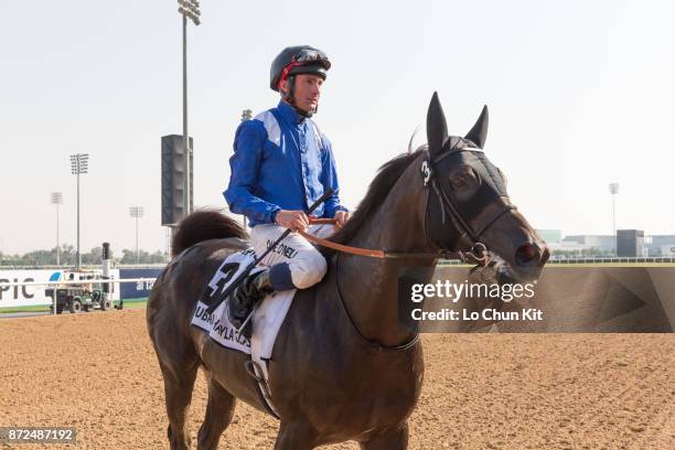 Jockey Dane O'Neill riding Manark wins the Dubai Kahayla Classic during the Dubai World Cup race day at the Meydan racecourse on March 28, 2015 in...