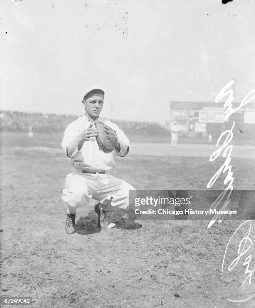 Informal full-length portrait of baseball player Ray Schalk of the American League's Chicago White Sox, holding his hands in front of him, crouching...
