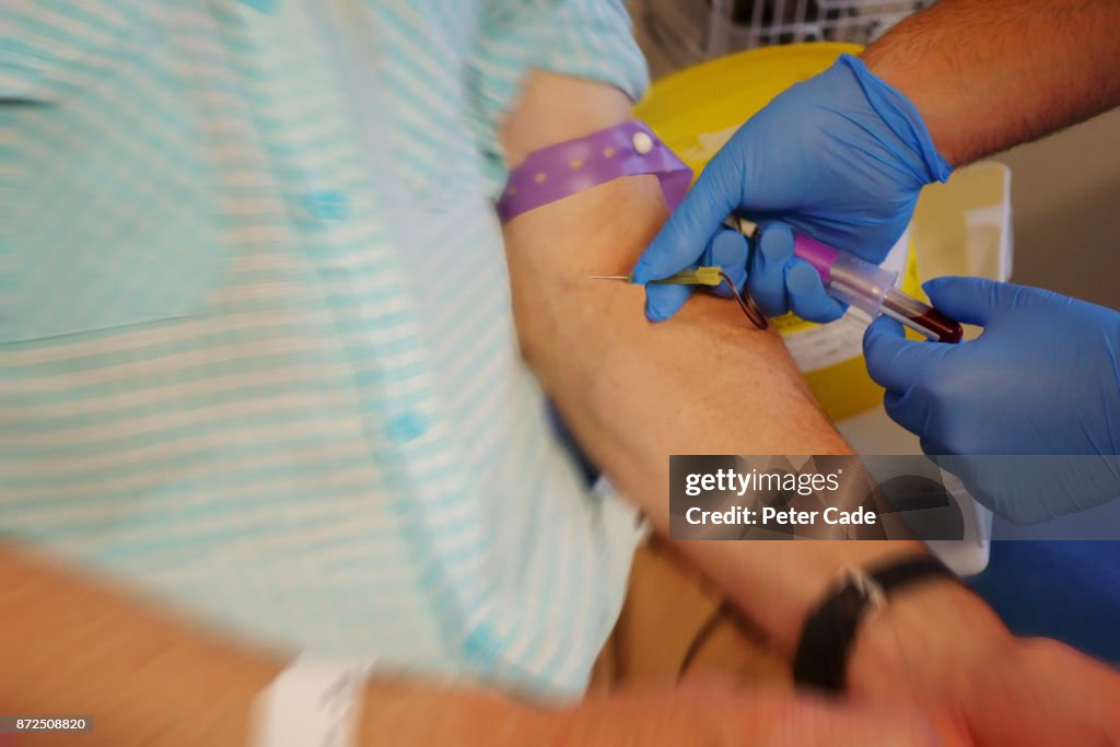 Blood being taken from mans arm