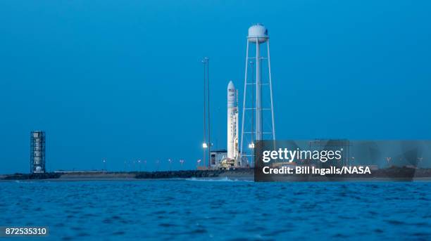 The Orbital ATK Antares rocket, with the Cygnus spacecraft onboard, is seen on launch Pad-0A, November 10, 2017 at NASA's Wallops Flight Facility in...