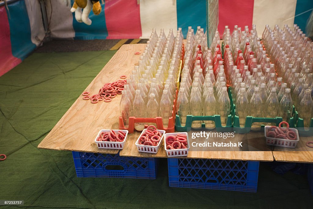 Carnival game with bottles and rings