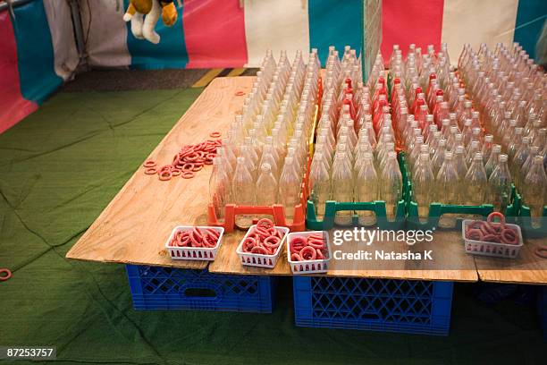 carnival game with bottles and rings - ring toss stock pictures, royalty-free photos & images