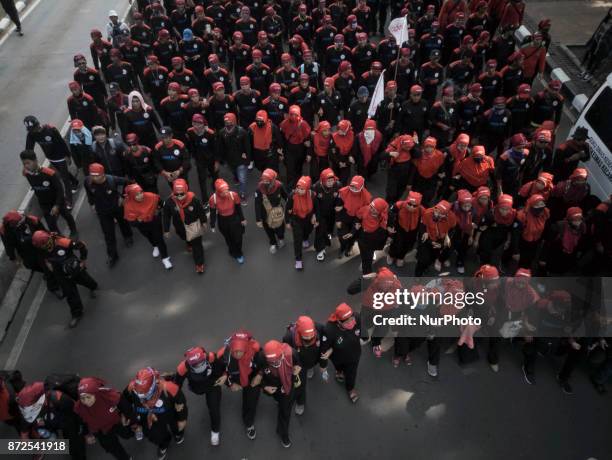 Jakarta, 10 Noember2017 : Thousands of Labor held demonstration in front of Jakarta Governor office at Merdeka Street. They demand the low minimum...