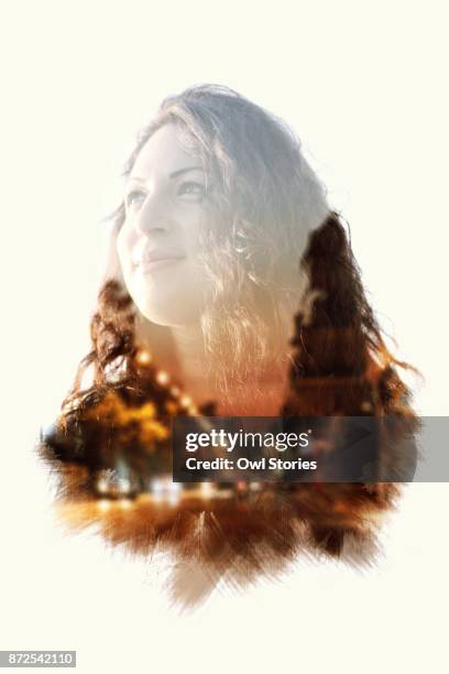 double exposure of a young beautiful woman and city street lights - double exposure portrait stock pictures, royalty-free photos & images